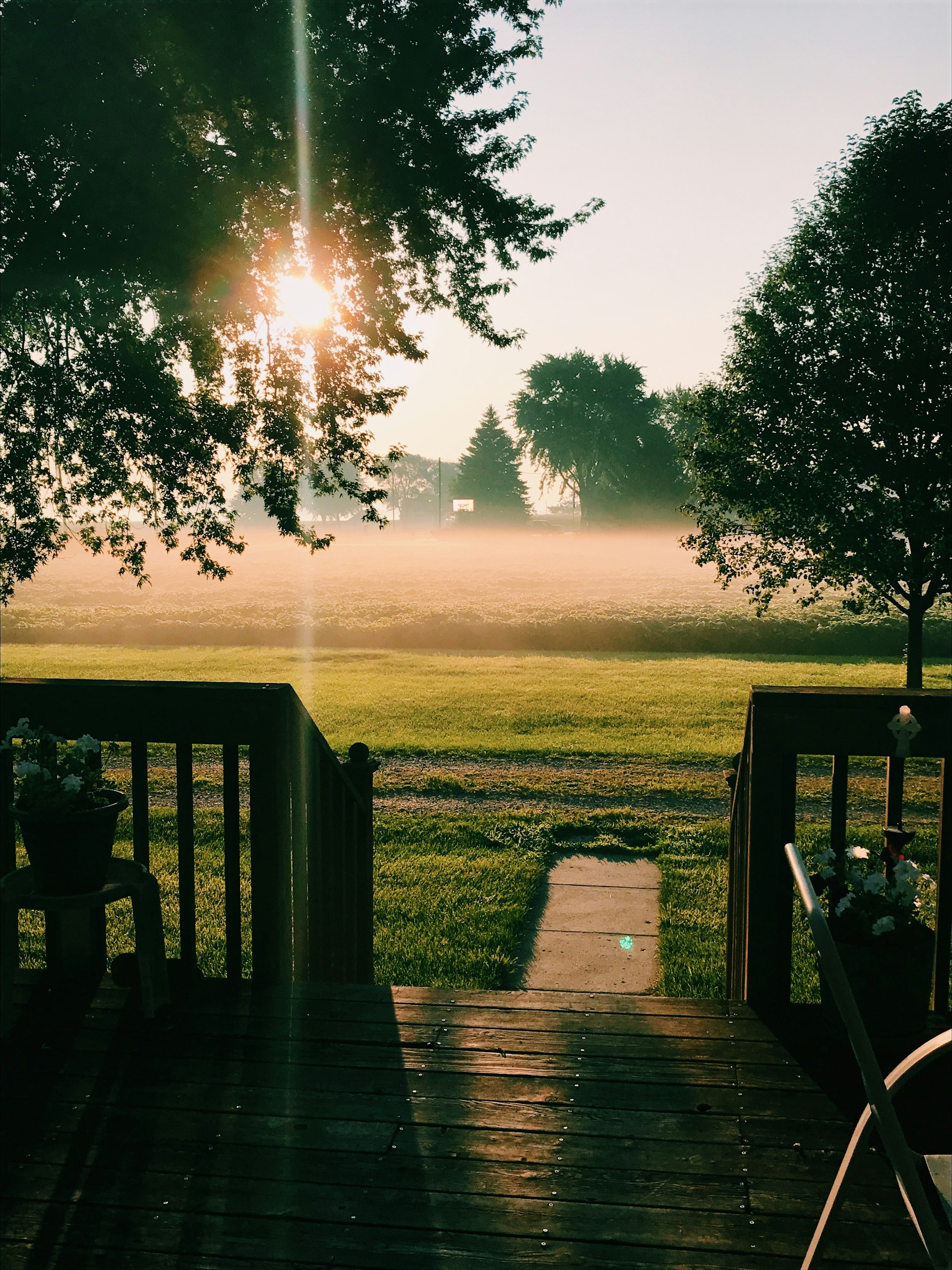 woman wearing yellow long-sleeved dress under white clouds and blue sky during daytime