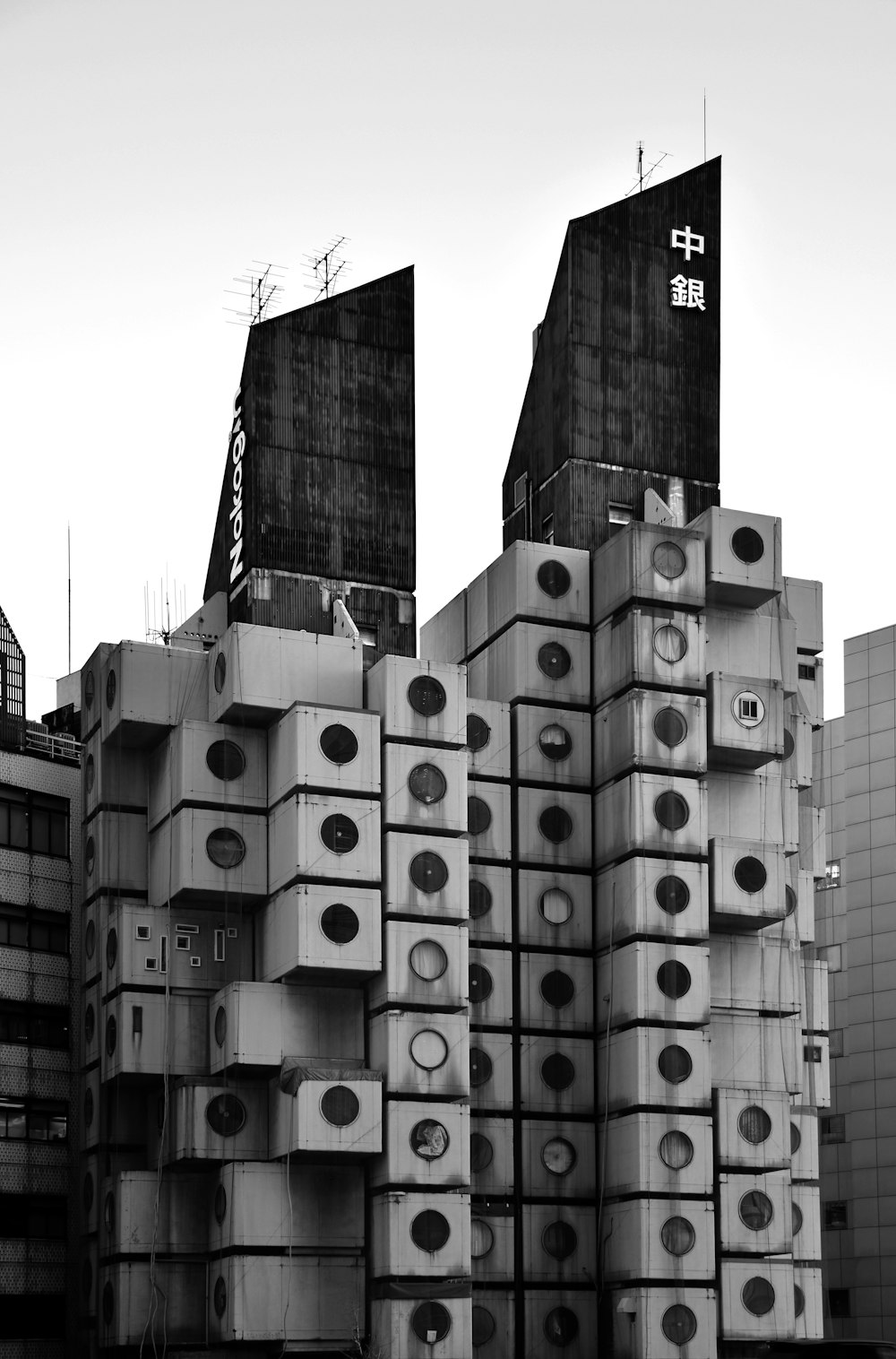 grayscale photo of city buildings