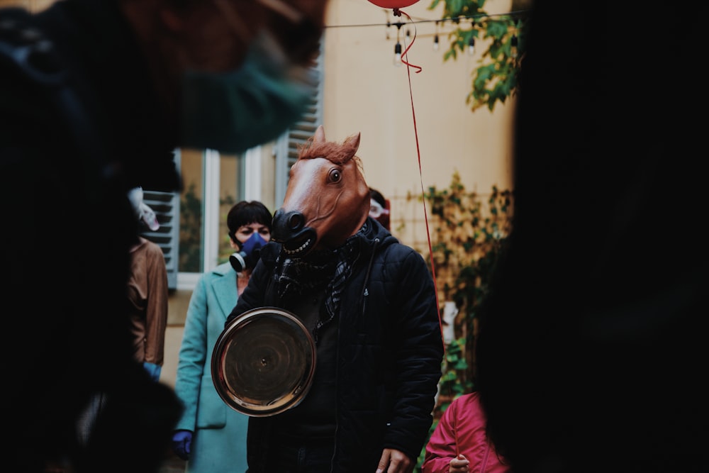 man in black leather jacket smoking cigarette