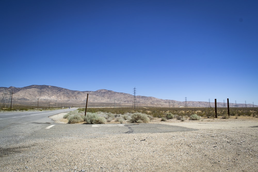 brown field under blue sky during daytime