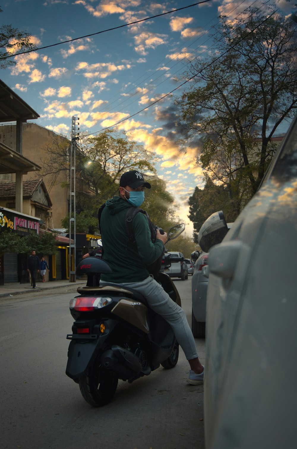 man in black jacket riding motorcycle during daytime