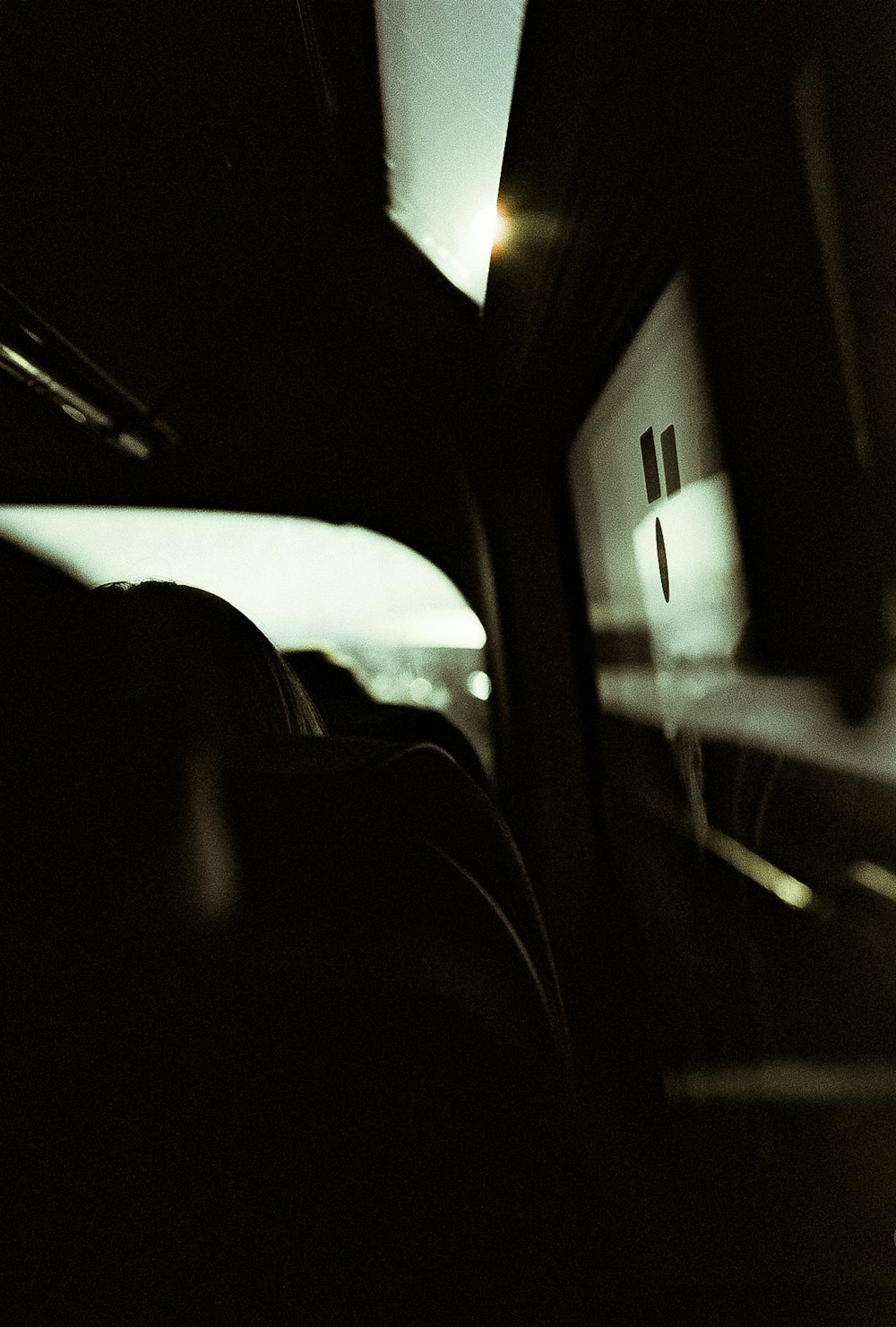 person sitting inside car during daytime