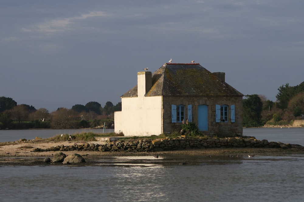 white concrete building near body of water during daytime