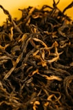 brown dried leaves on yellow surface