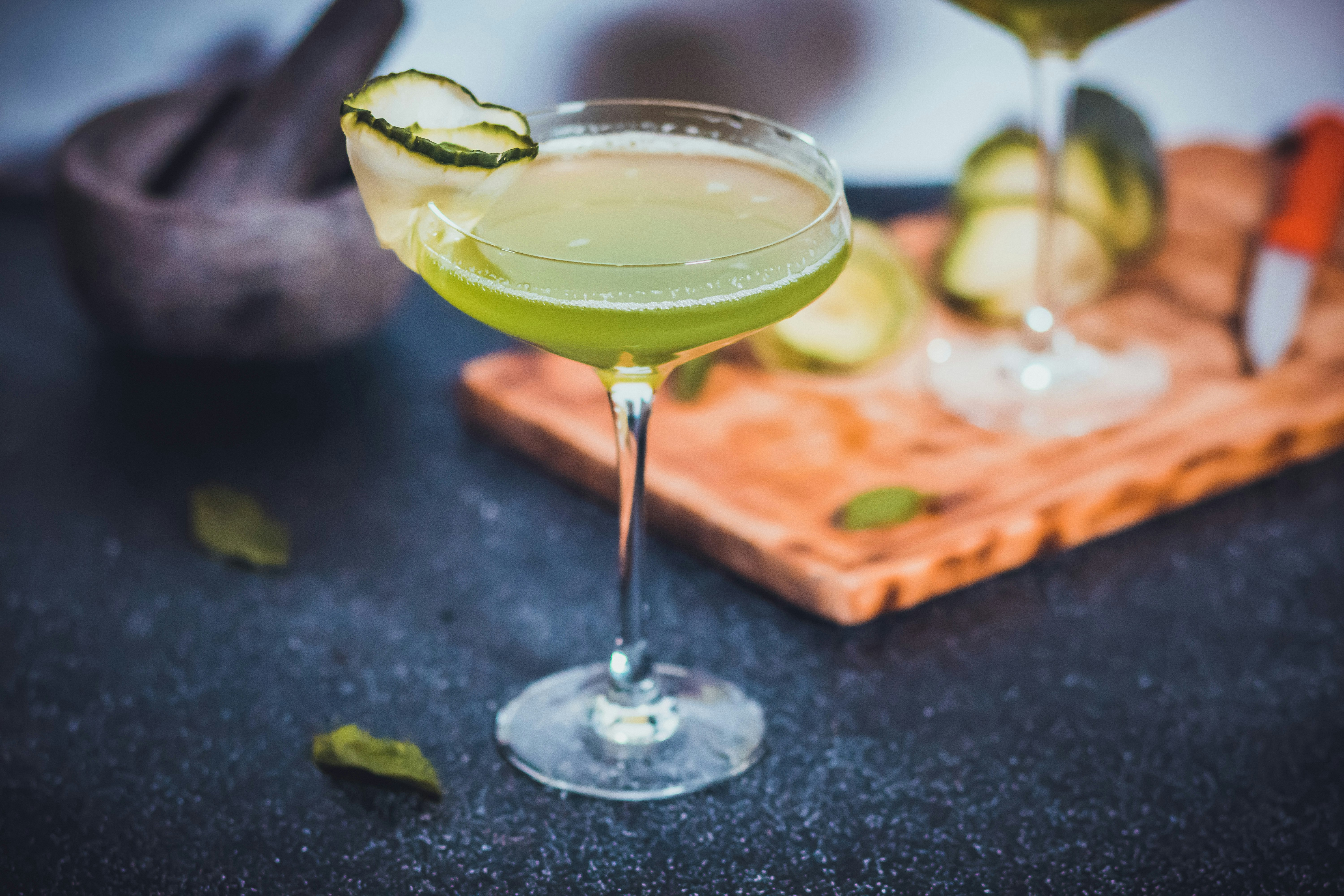 clear wine glass with green liquid