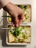 person holding green vegetable salad