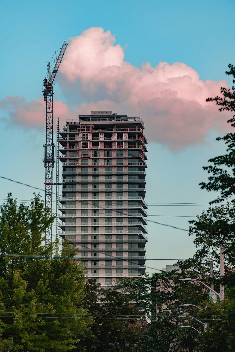 black high rise building under cloudy sky during daytime
