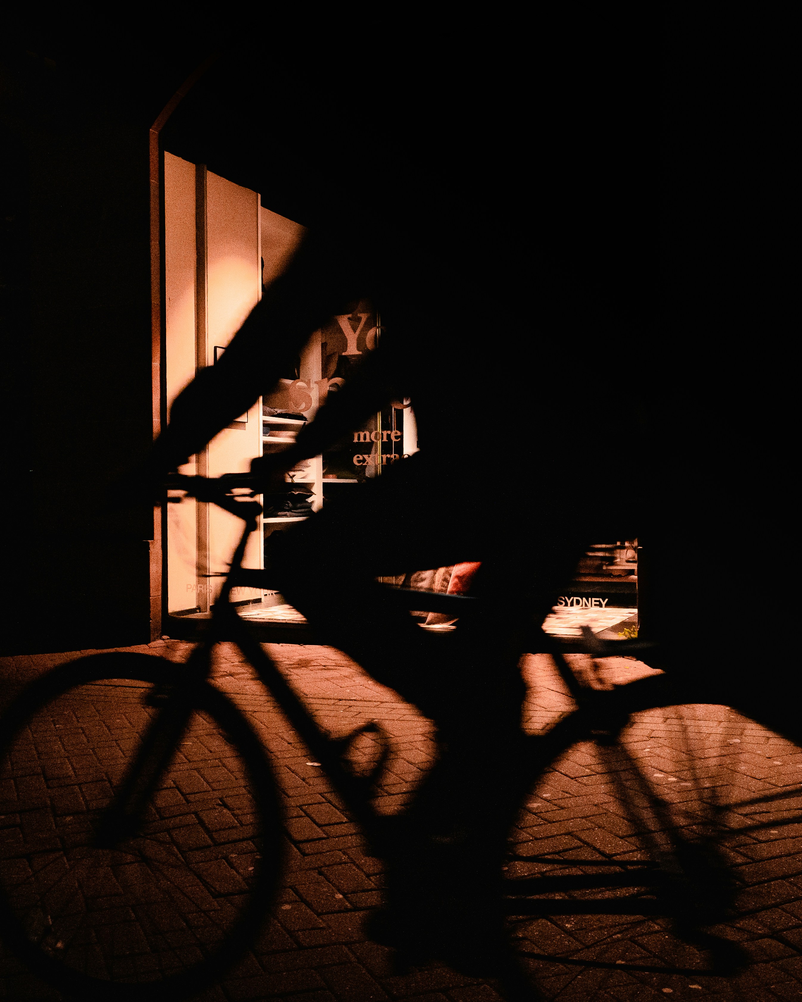 silhouette of bicycle in a dark room