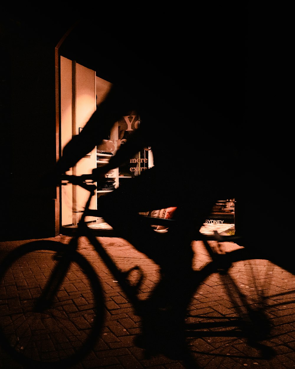 silhouette of bicycle in a dark room
