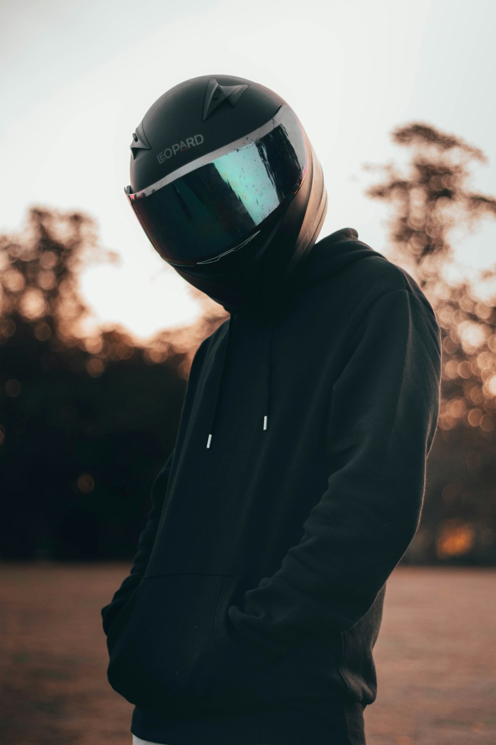 man in black hoodie wearing black helmet