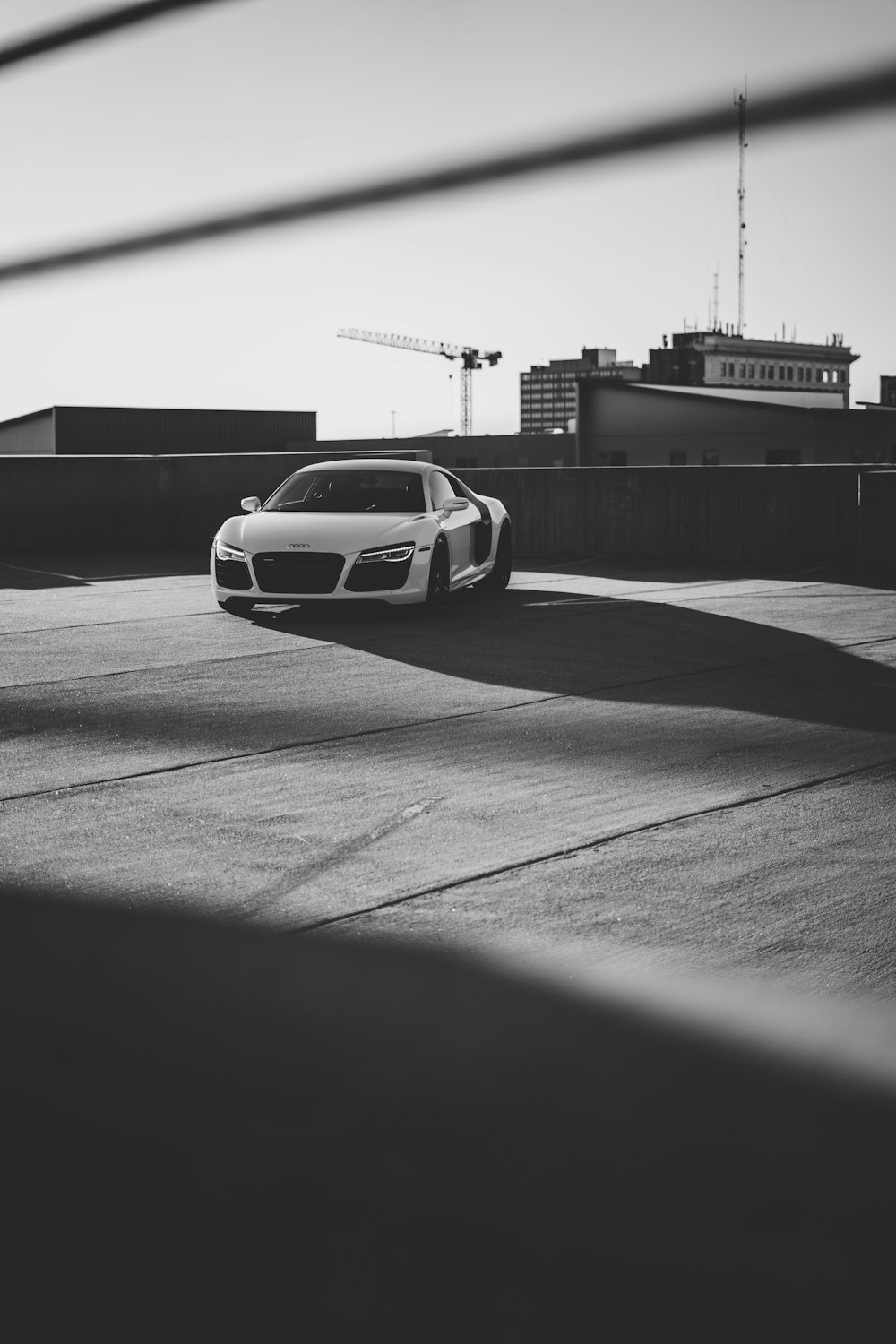 grayscale photo of car on road