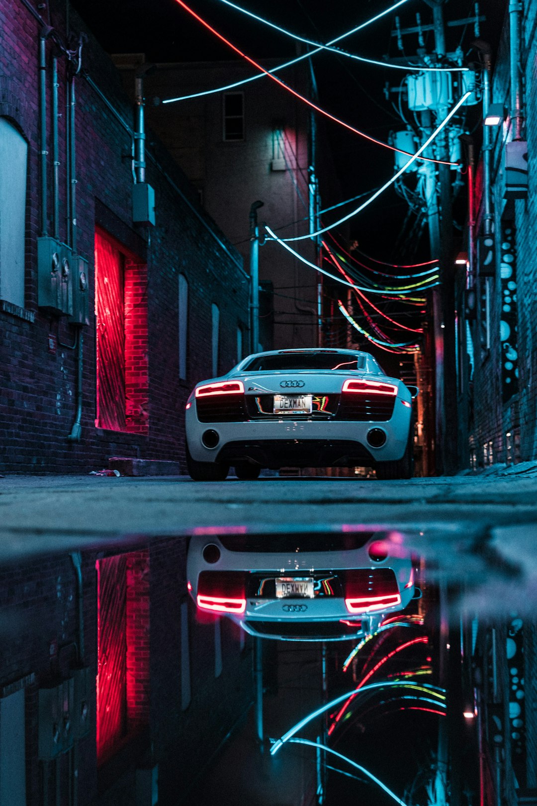 white car parked beside building