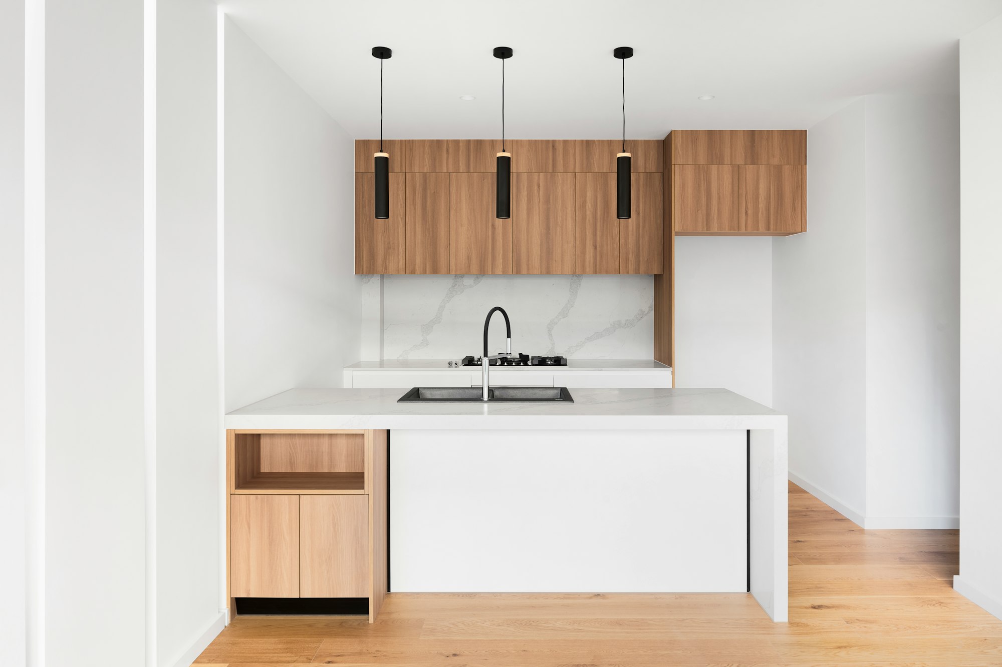 Kitchen with wooden cupboards.