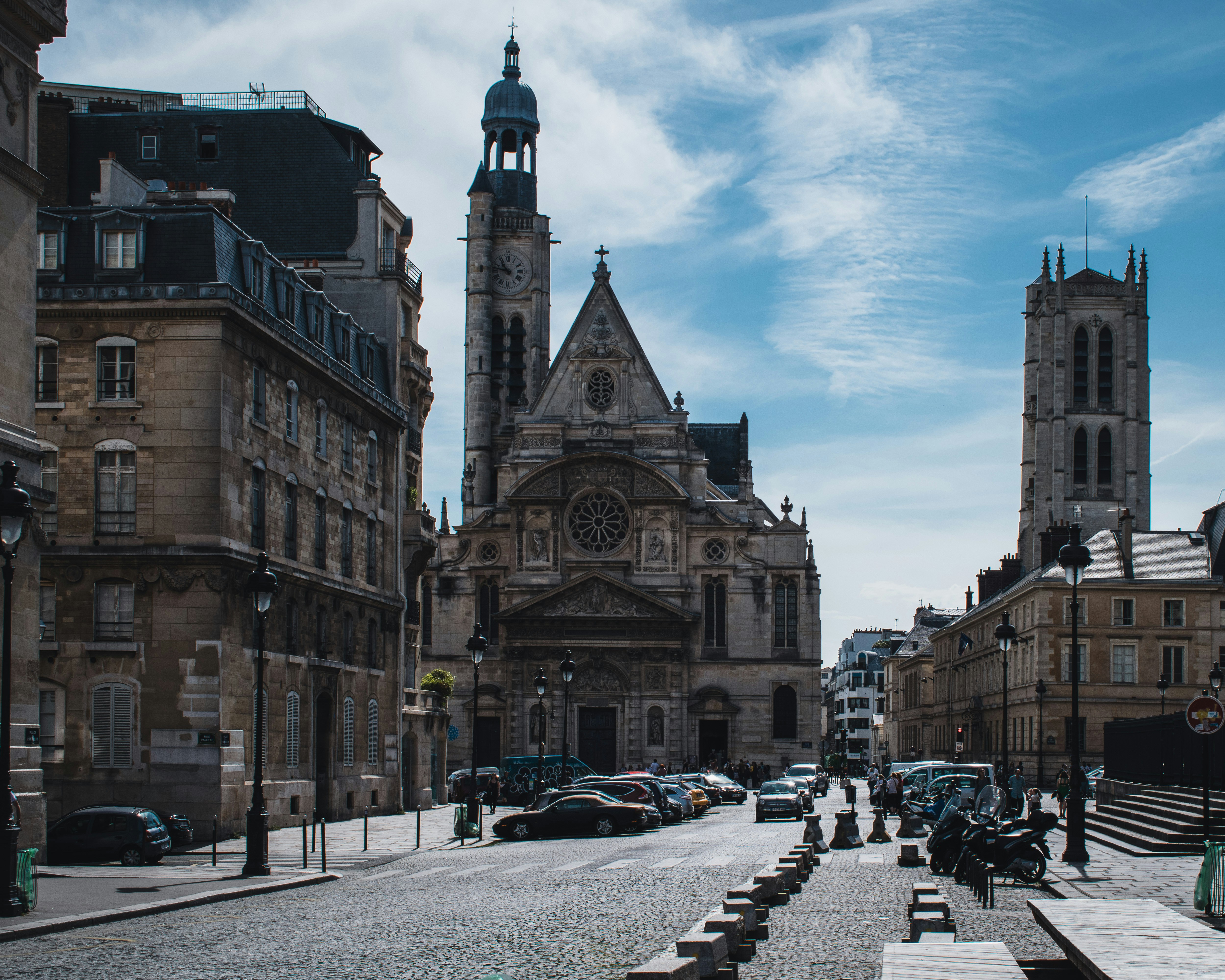 people walking on street near brown concrete building during daytime