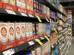 red and white labeled plastic bottle on shelf