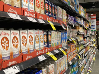 red and white labeled plastic bottle on shelf