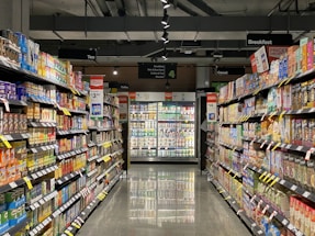 white and red labeled pack on white shelf