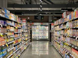grocery store aisle with stocked shelves