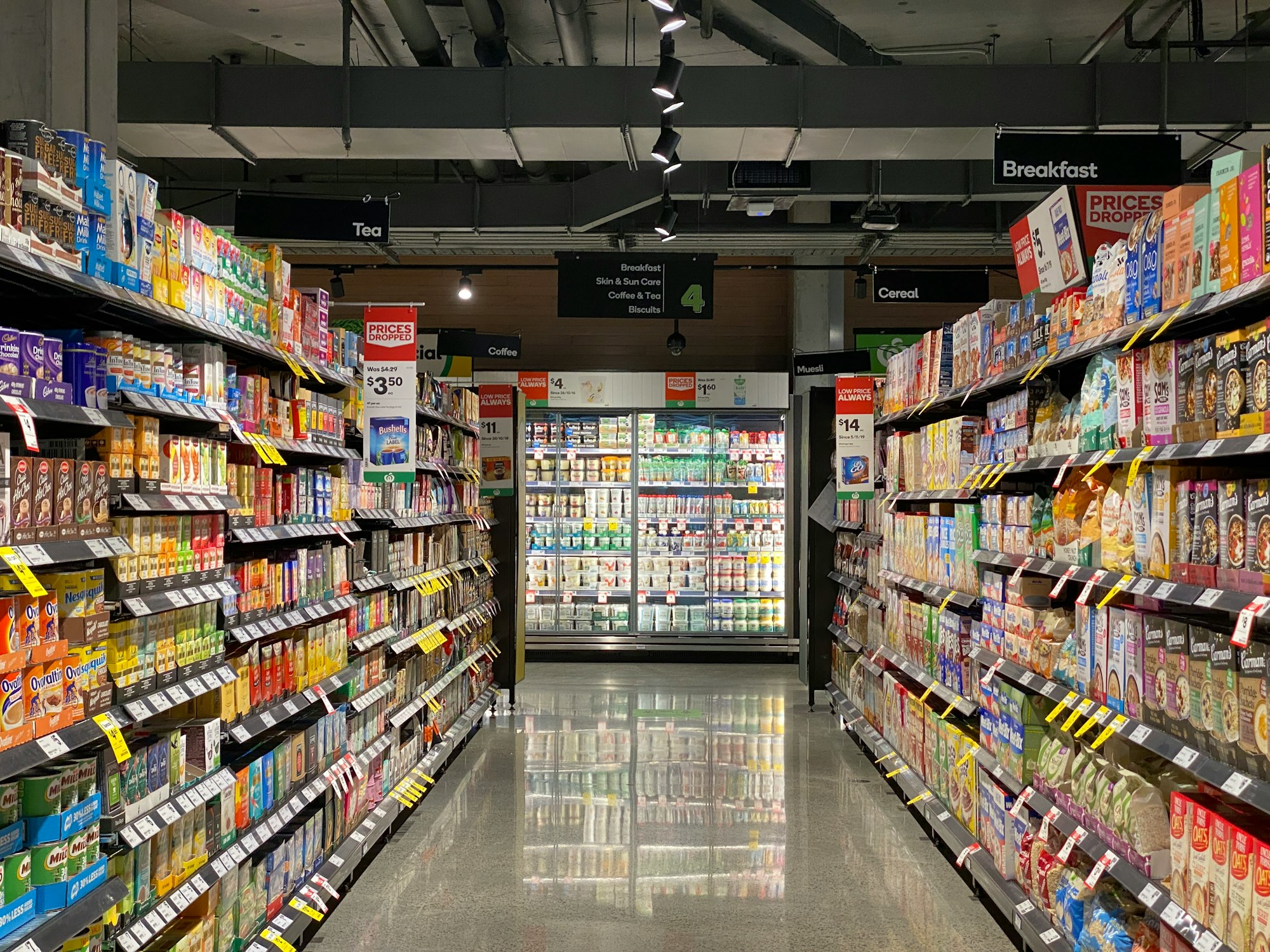 aisle, food, cheese, dairy refrigeration, cookies, biscuit, cereal, tea, coffee, yogurt, almond, rice, soy milk rice, spice, sauce, cereal, quick milk, store shelf shelf,  store, supermarket, supermarket aisle
