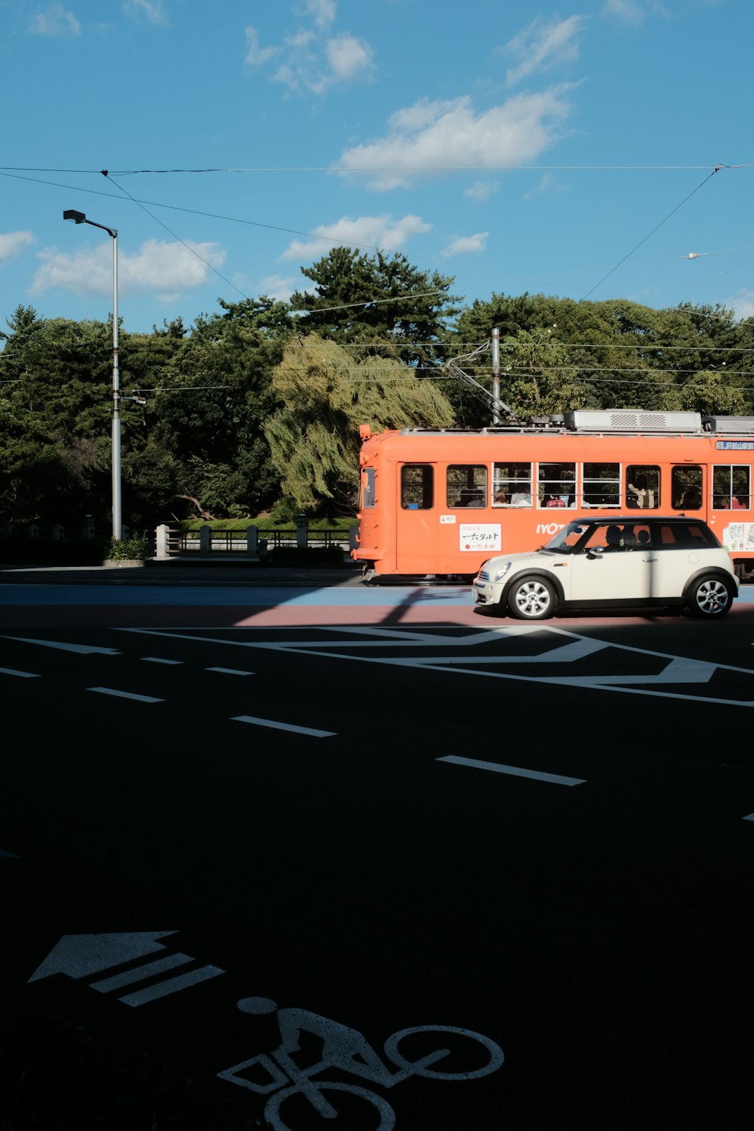 orange bus on road during daytime