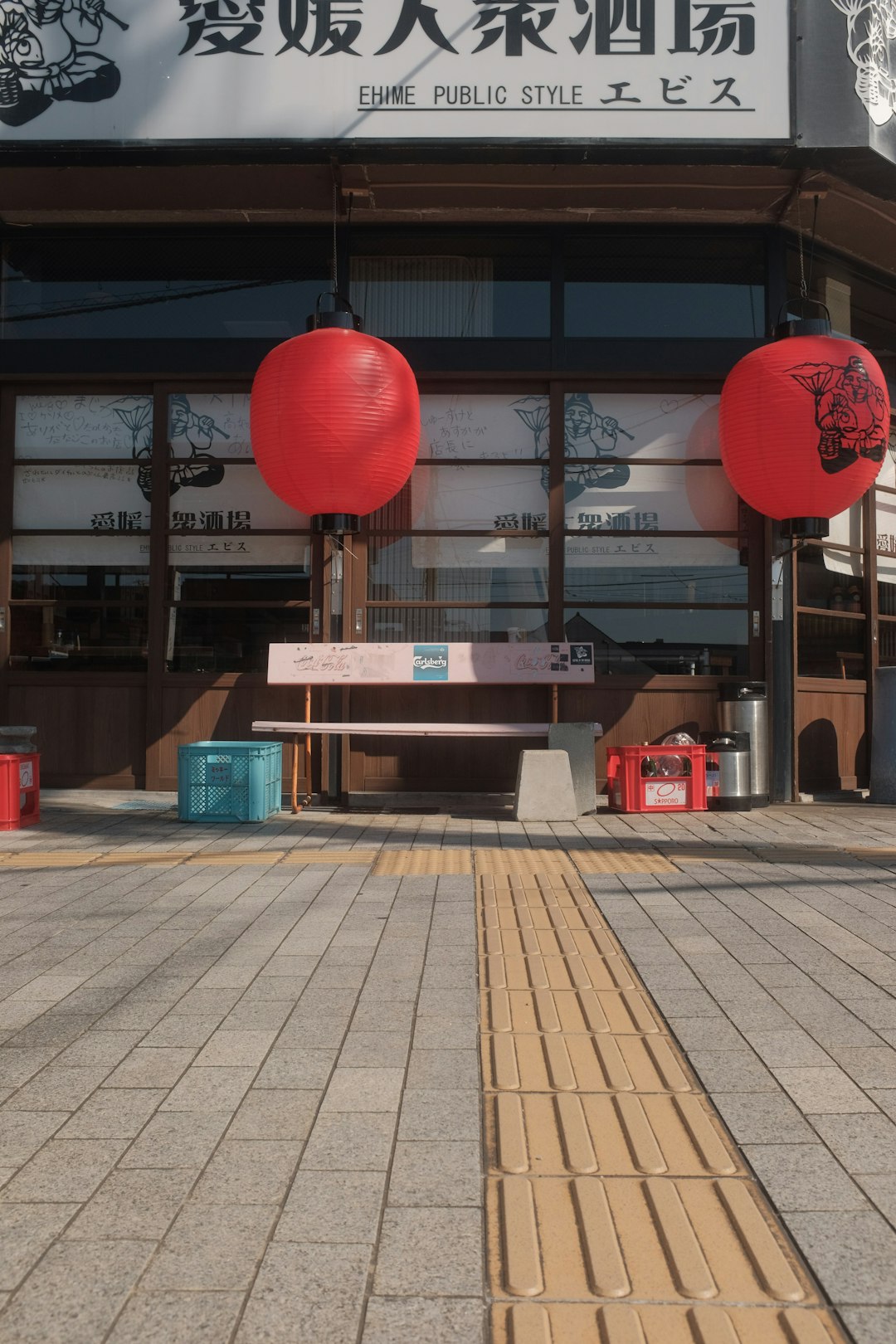 red lantern on brown wooden bench