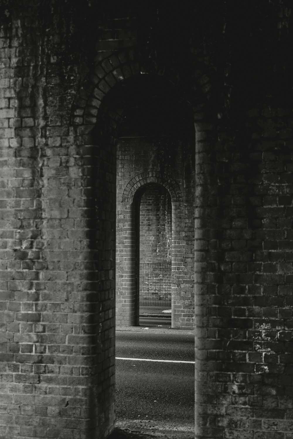 gray brick wall with white wooden door