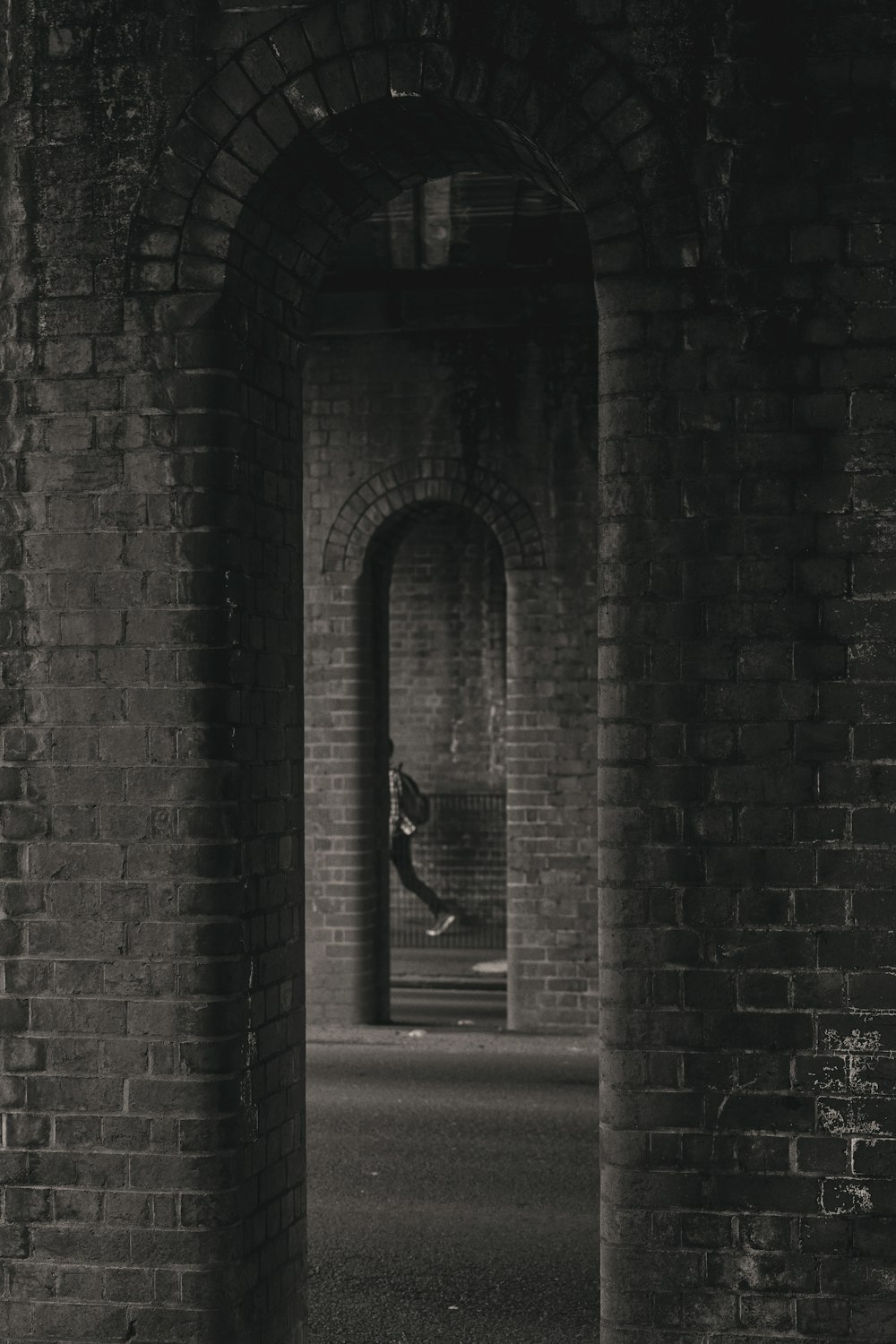 black metal door on gray brick wall