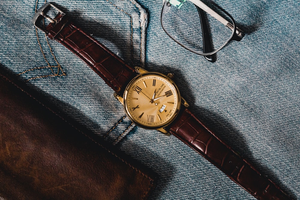 brown leather strap silver round analog watch