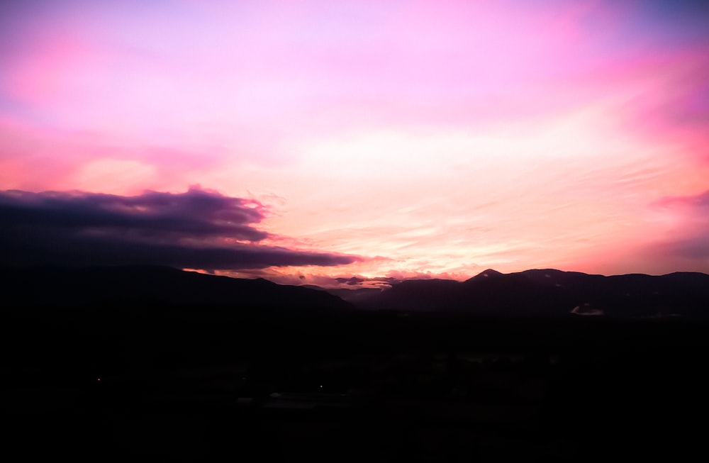 silhouette of mountains during sunset