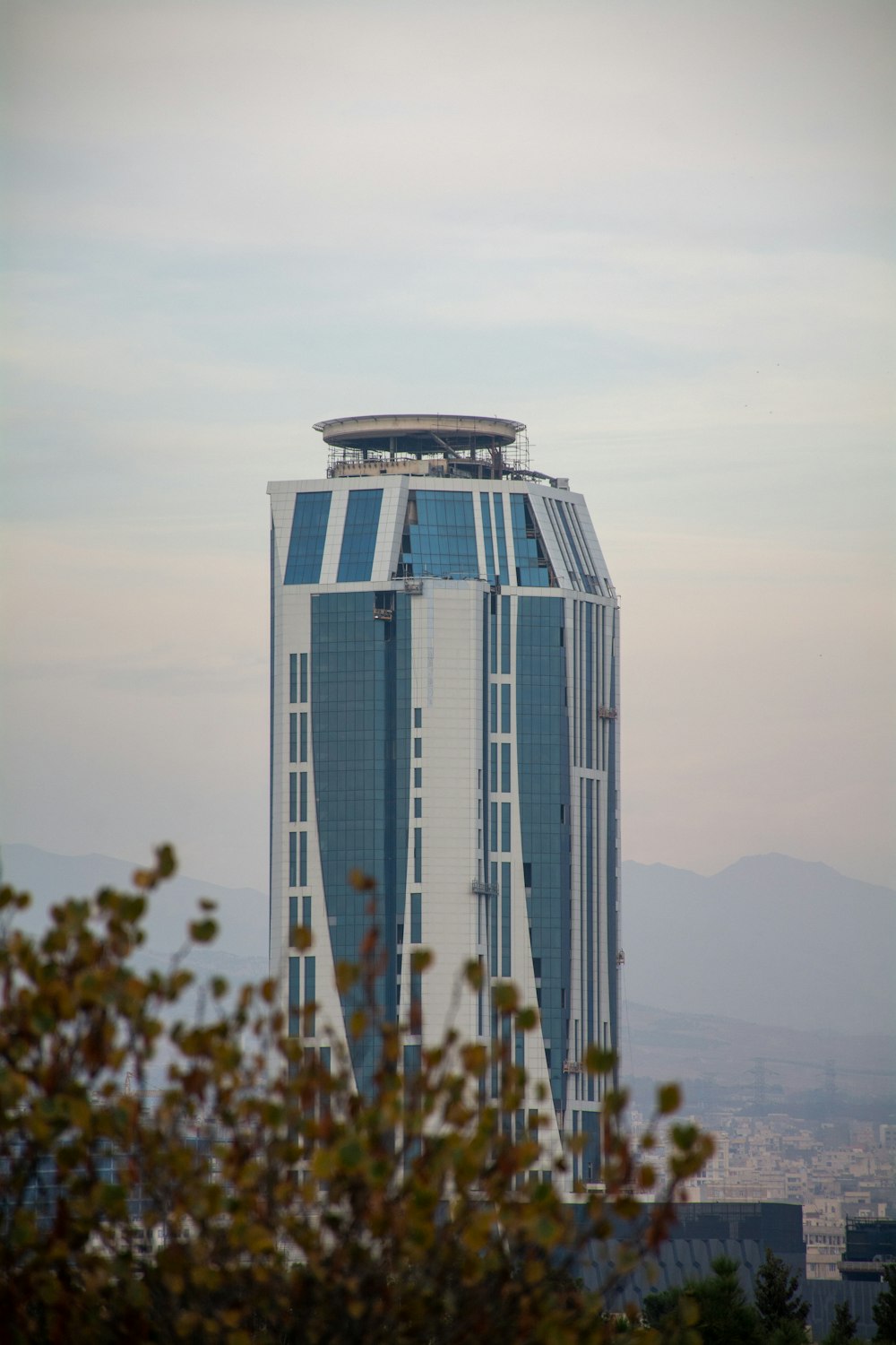 white and black concrete building near body of water during daytime