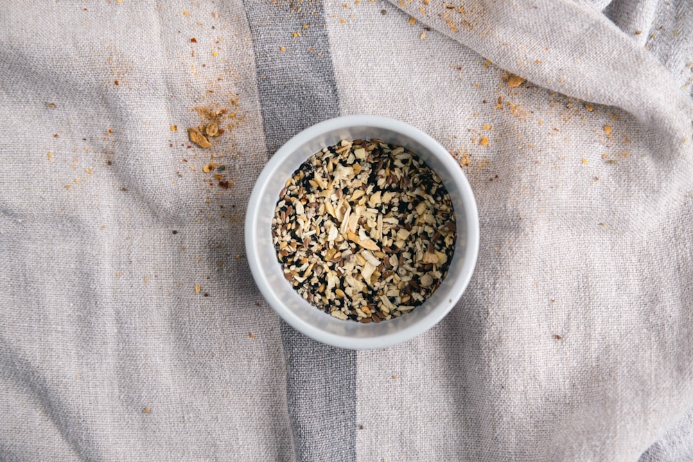 white ceramic bowl with brown seeds