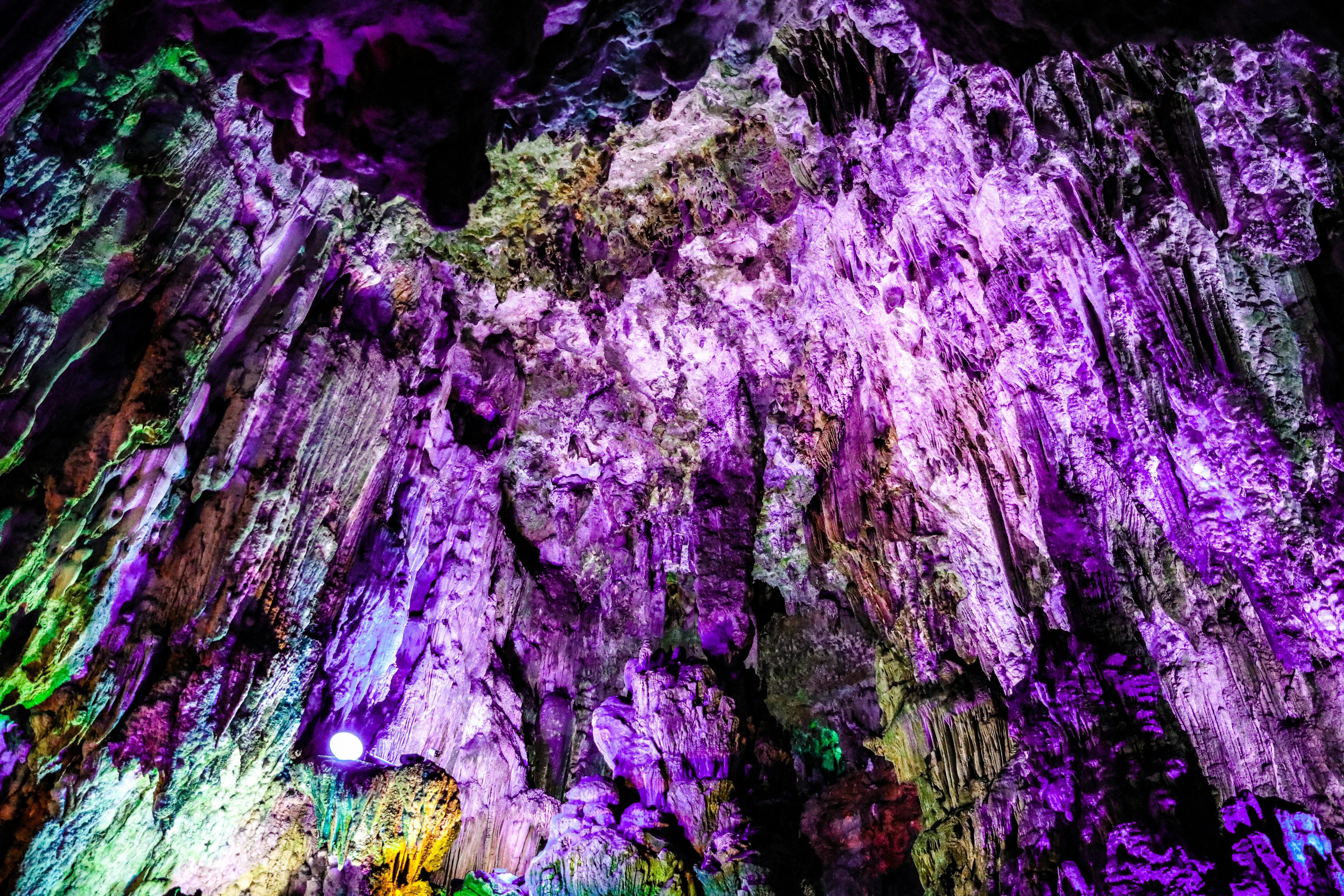 Ethereal glowing crystal formations in a dark mystical cave, cyan and purple bioluminescent light, otherworldly atmosphere