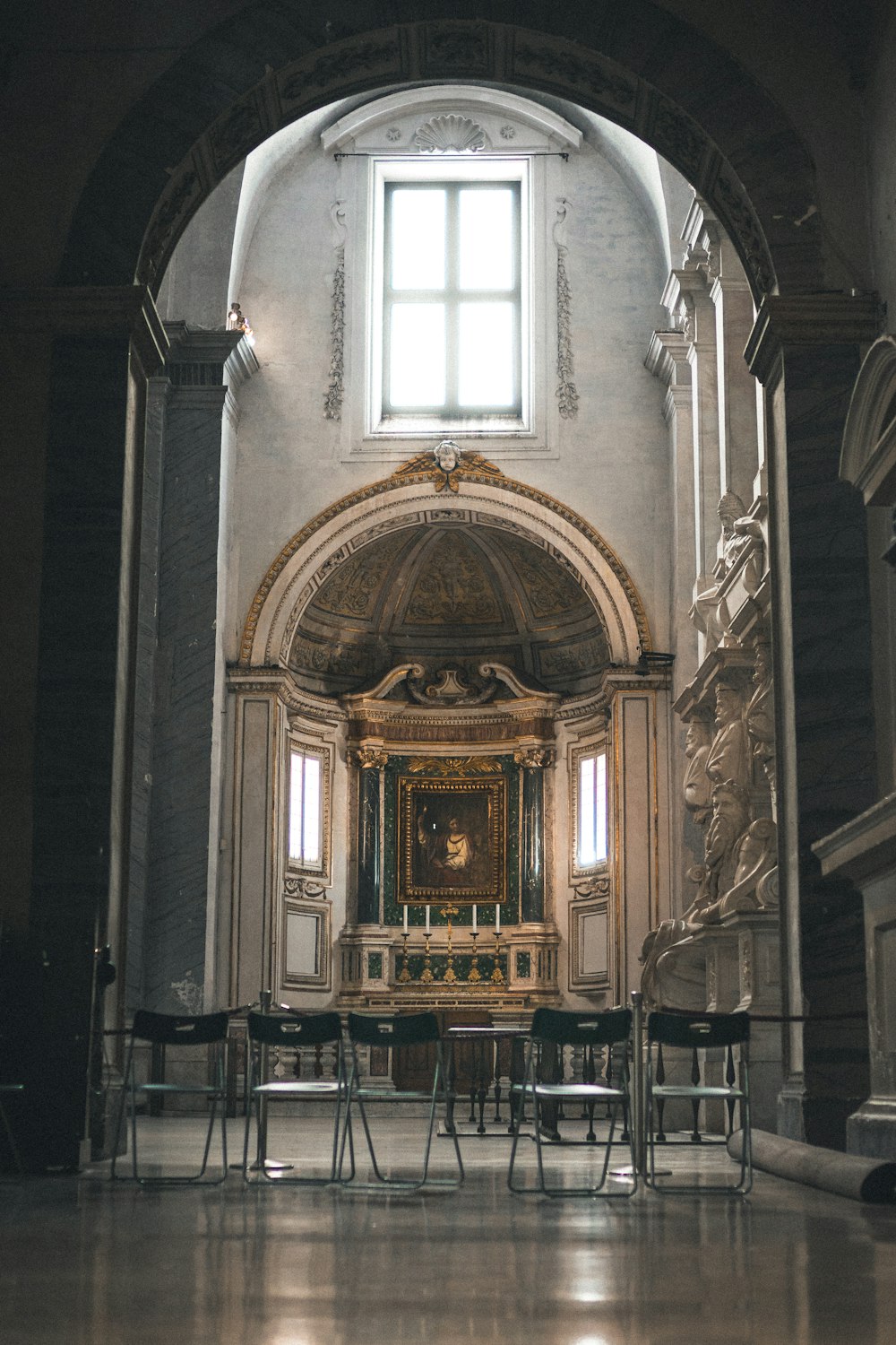 people sitting on chairs inside cathedral