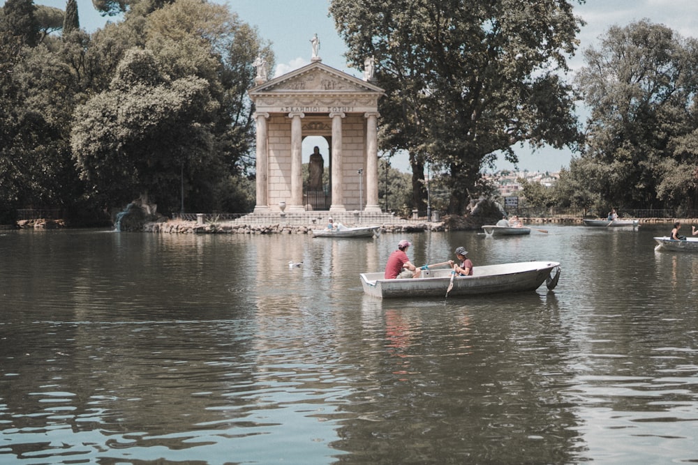 people riding on boat on river during daytime