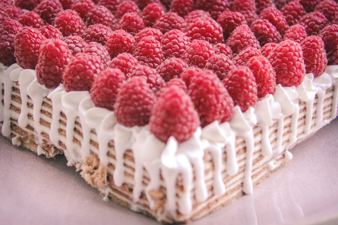 red and white cake on brown wooden tray