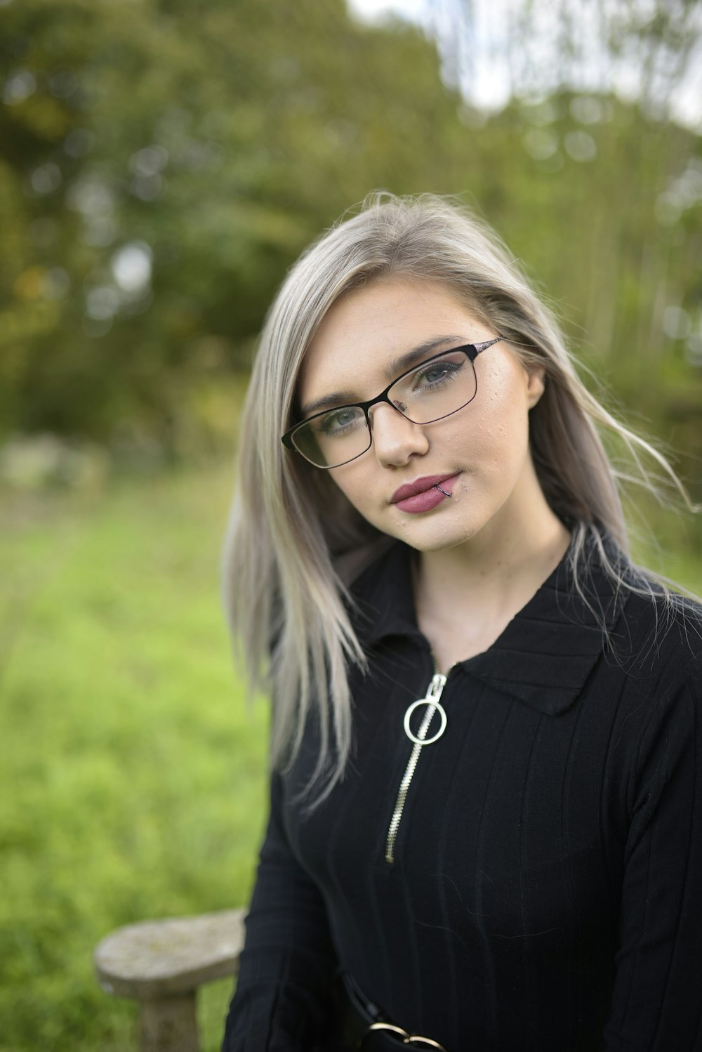 woman in black shirt wearing black framed eyeglasses