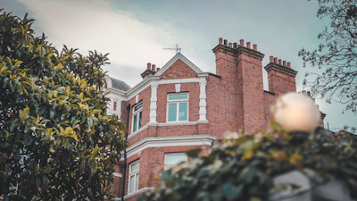 brown concrete building under gray sky