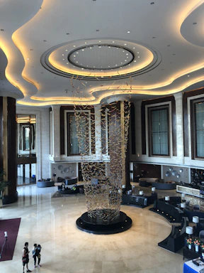 Elegant office lobby with a subtle rhinoceros sculpture symbolizing strength and trust.