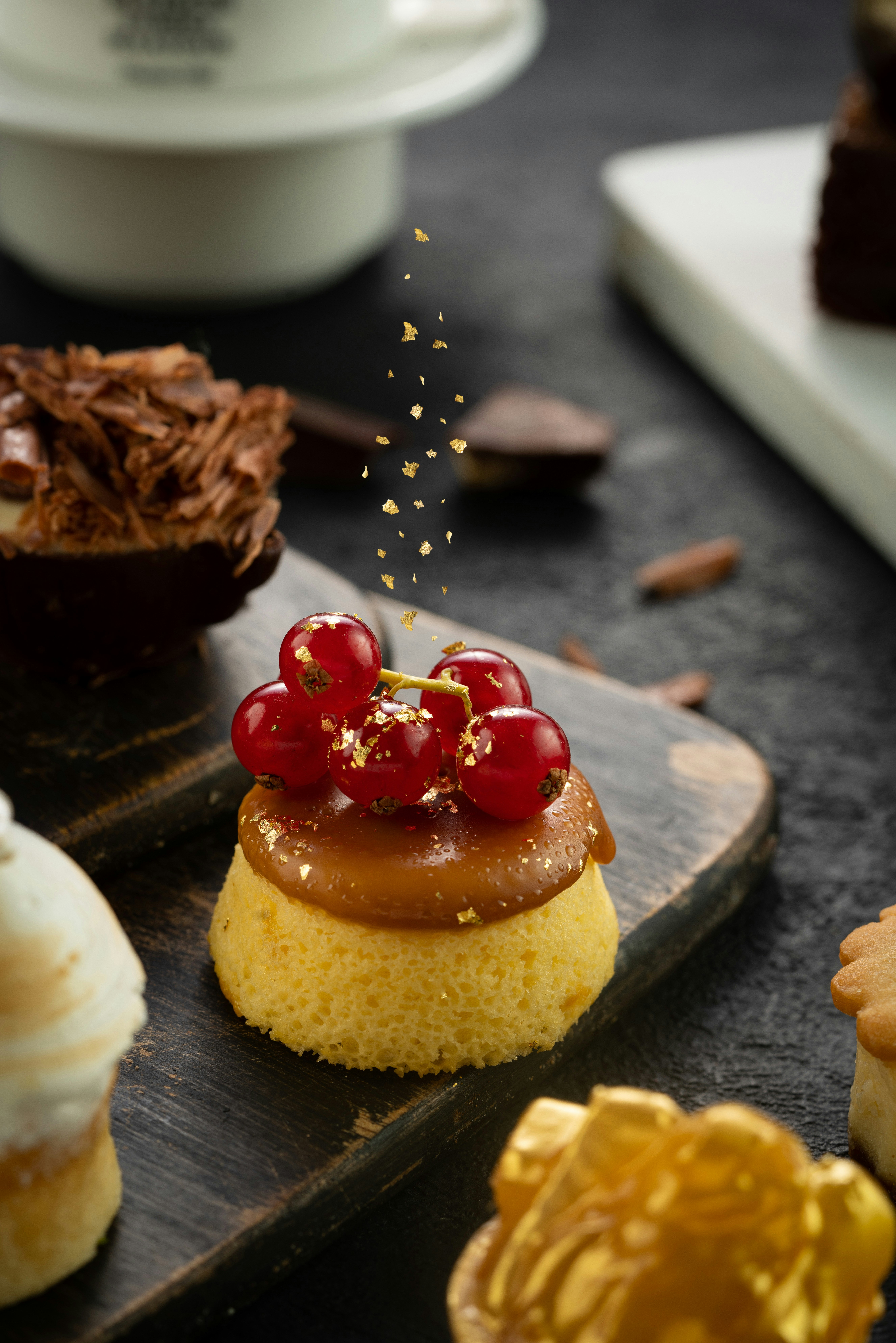 brown cake with red and white icing on brown wooden table