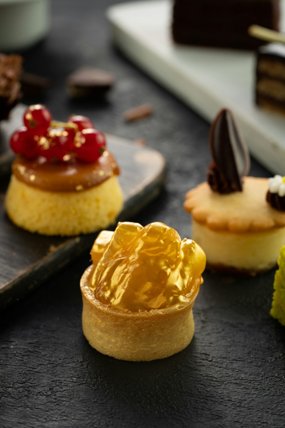 yellow and brown cupcake on black wooden table