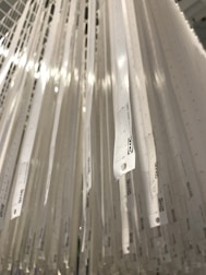 A set of measuring rulers with clear markings laid out on a white background.