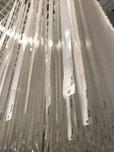 A set of measuring rulers with clear markings laid out on a white background.