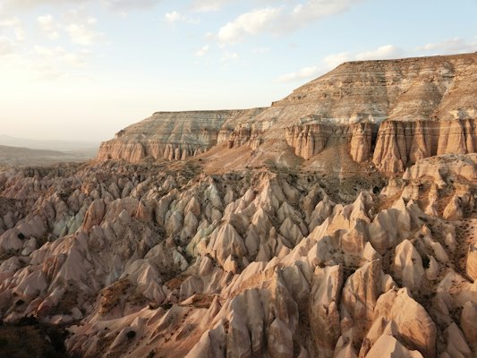 Brown rocky mountain under white clouds during daytime — Cappadocia, Turkey