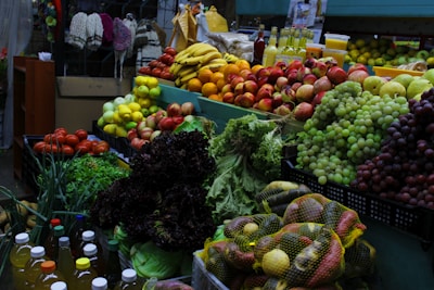 variety of fruits on green plastic crate