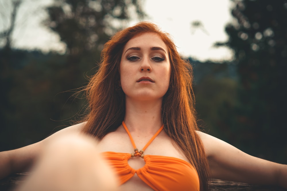 woman in orange halter top