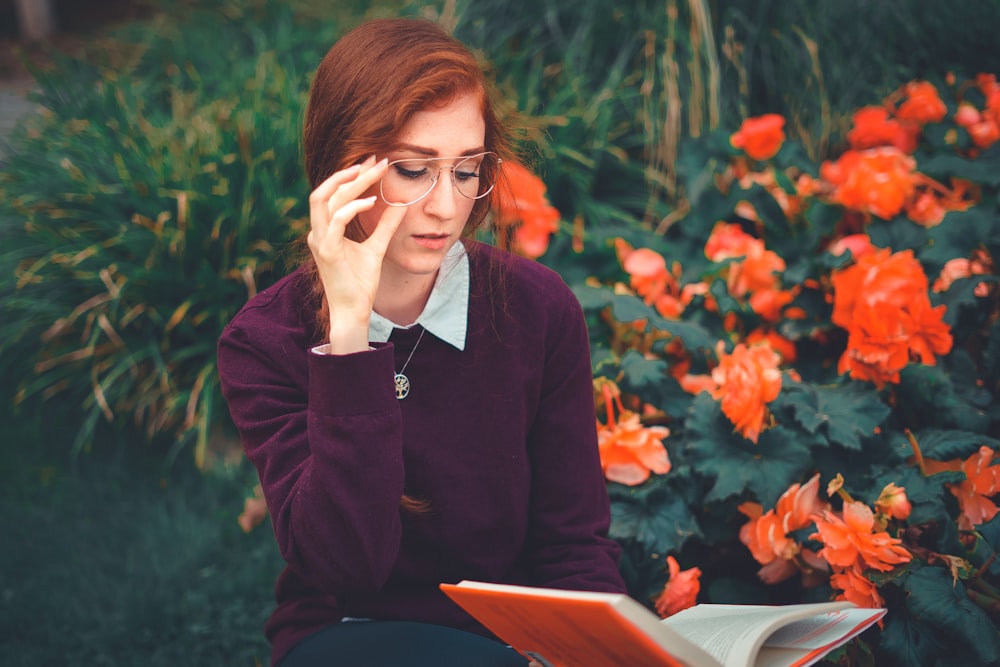 woman in black long sleeve shirt wearing eyeglasses