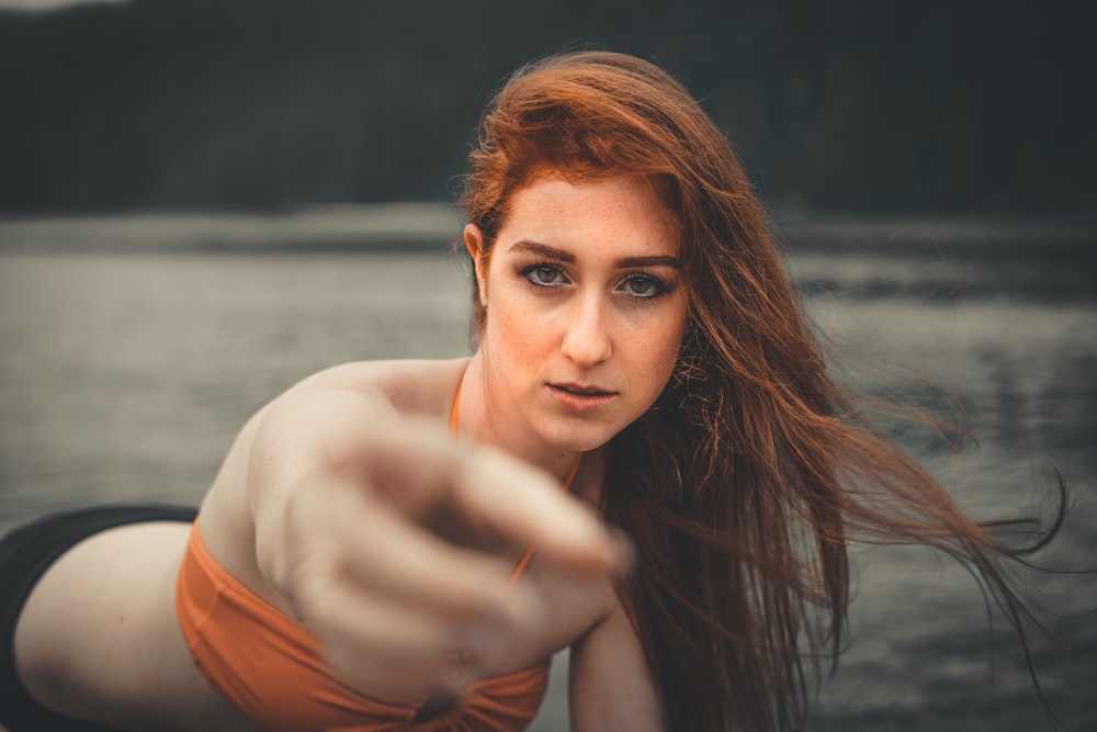 woman in orange tank top