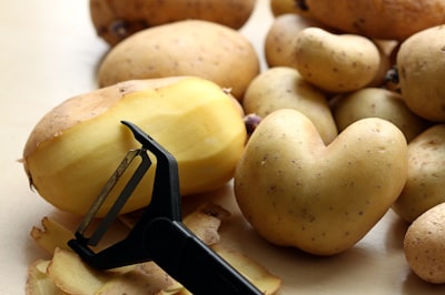 yellow fruit on brown wooden table potato zoom background