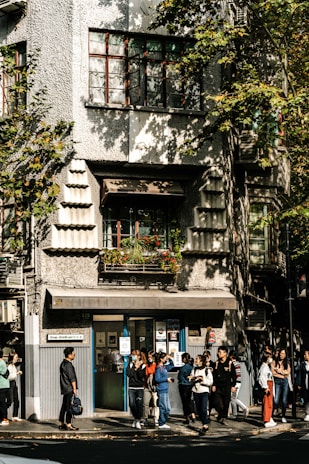 A group photo of the ES Research Center team standing outside the facility on a sunny day.
