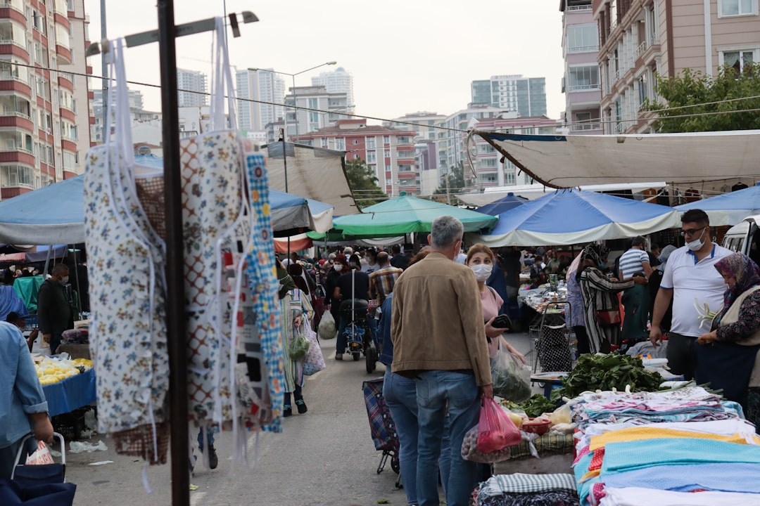 people walking on market during daytime